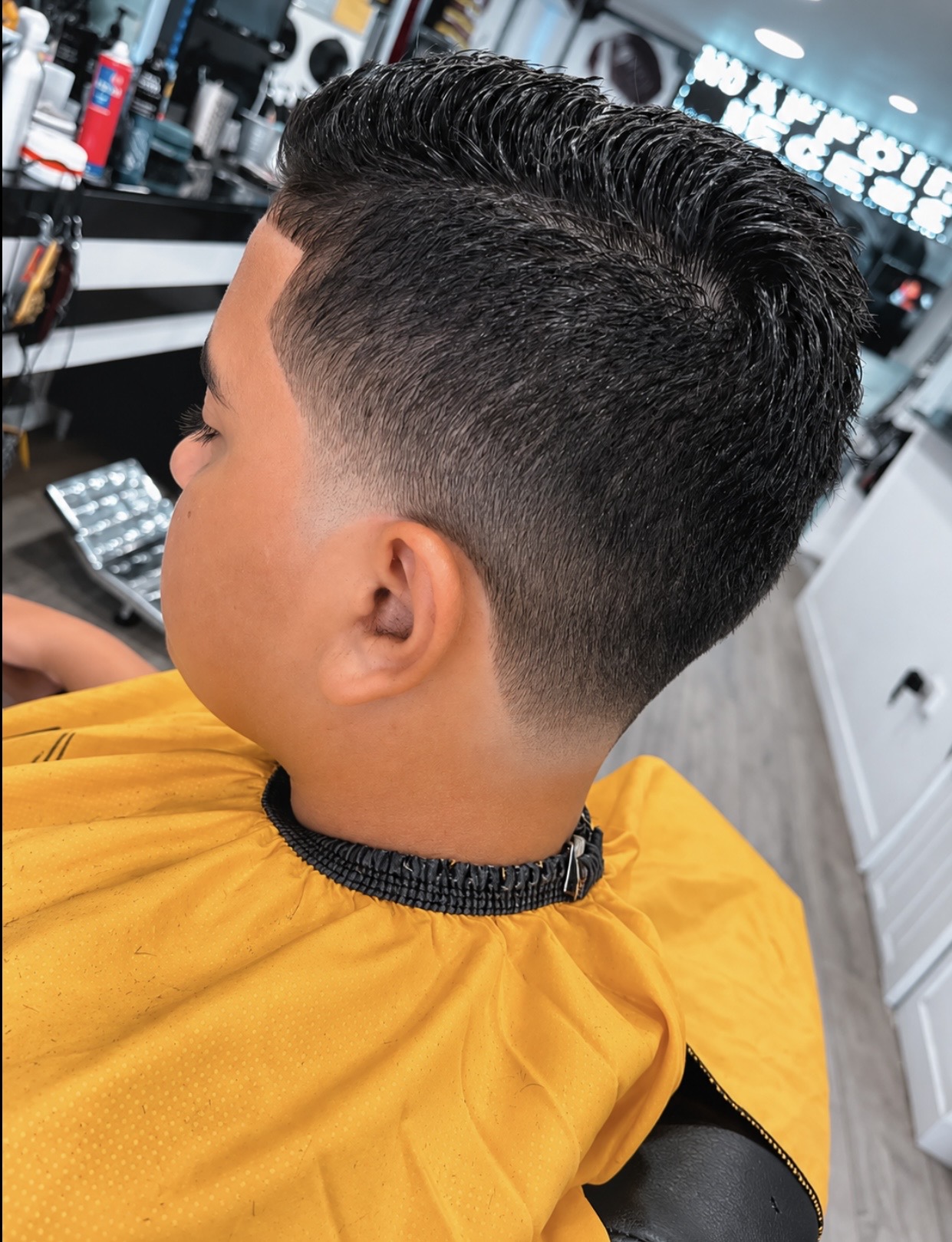 Precision fade with a neatly styled textured haircut